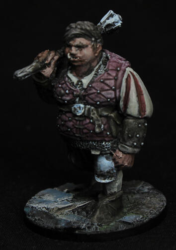 A painted model of a fantasy character - ogre lady dressed for renaissaince period, carrying a mace on her shoulder.